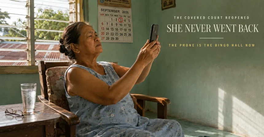 Older Filipina woman squinting at a phone held at arm's length in bright afternoon light